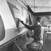 Louis Van Lint werkt aan een muurschildering, circa 1957